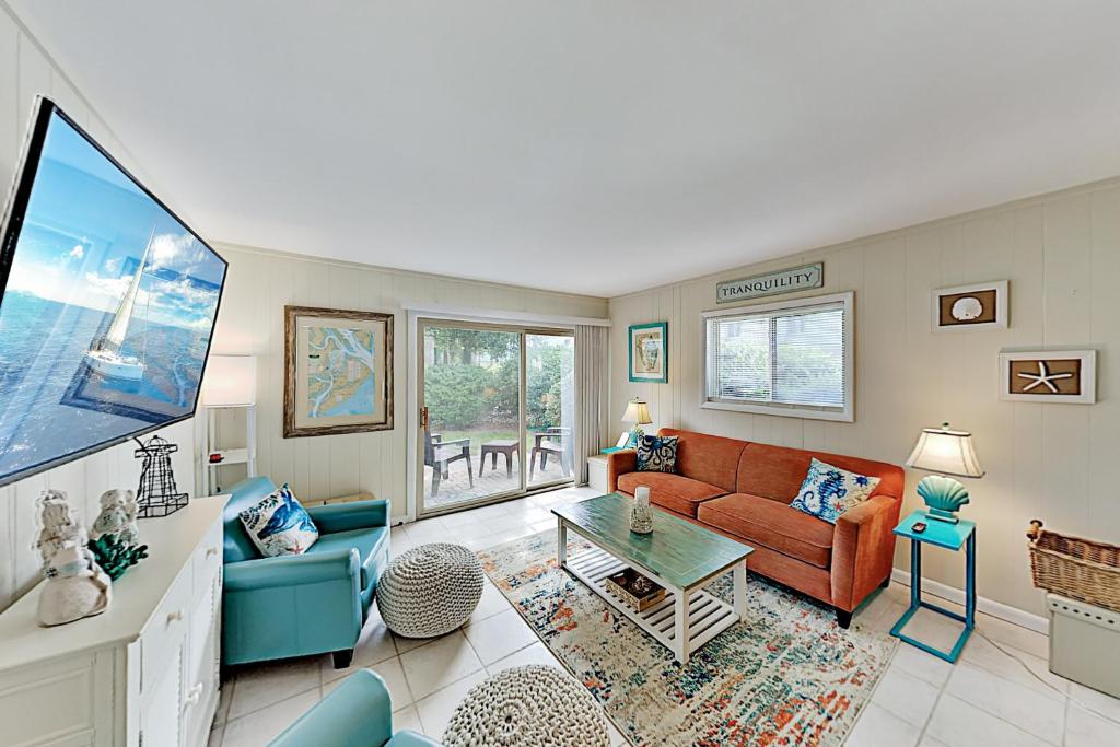 a living room with a couch and a table at Hilton Head Cabanas 29 in Hilton Head Island