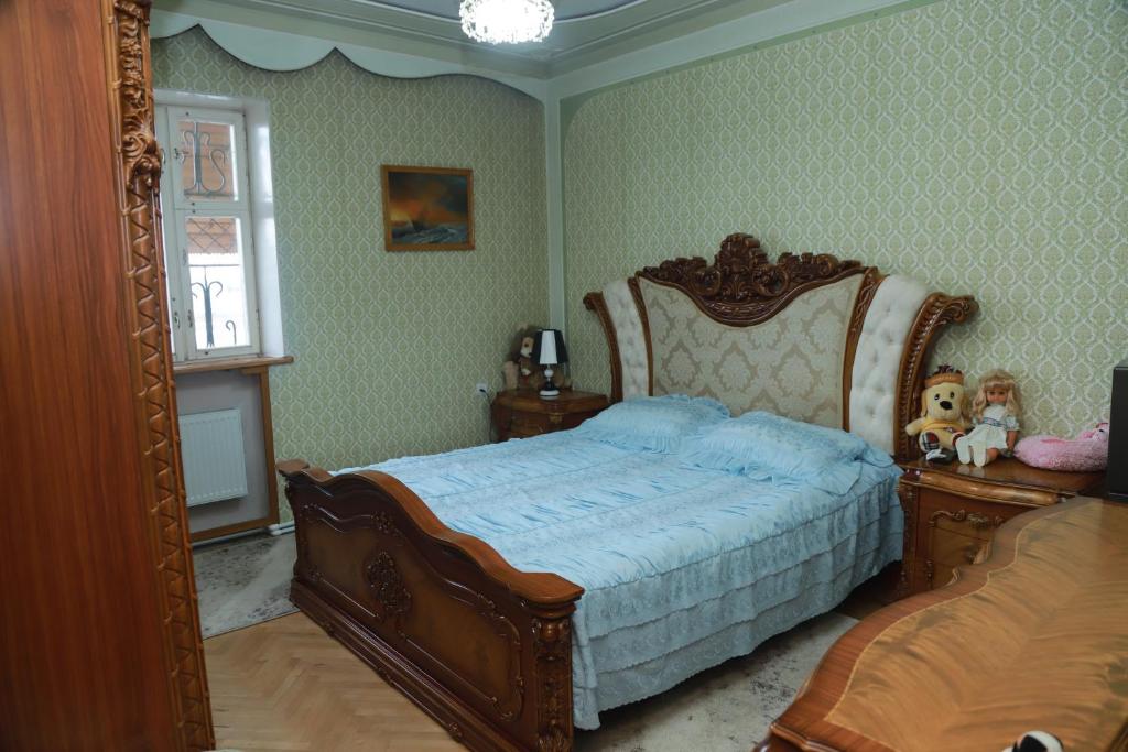 a bedroom with a bed and a large mirror at Norik's Guest House in Sevan