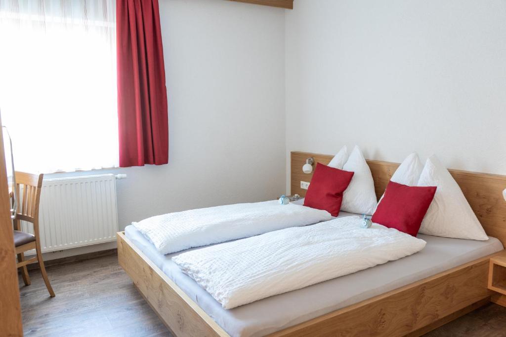 Postel nebo postele na pokoji v ubytování Nigglerhof