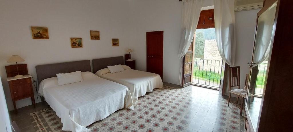Postel nebo postele na pokoji v ubytov&aacute;n&iacute; Casa Castellitx Mallorca