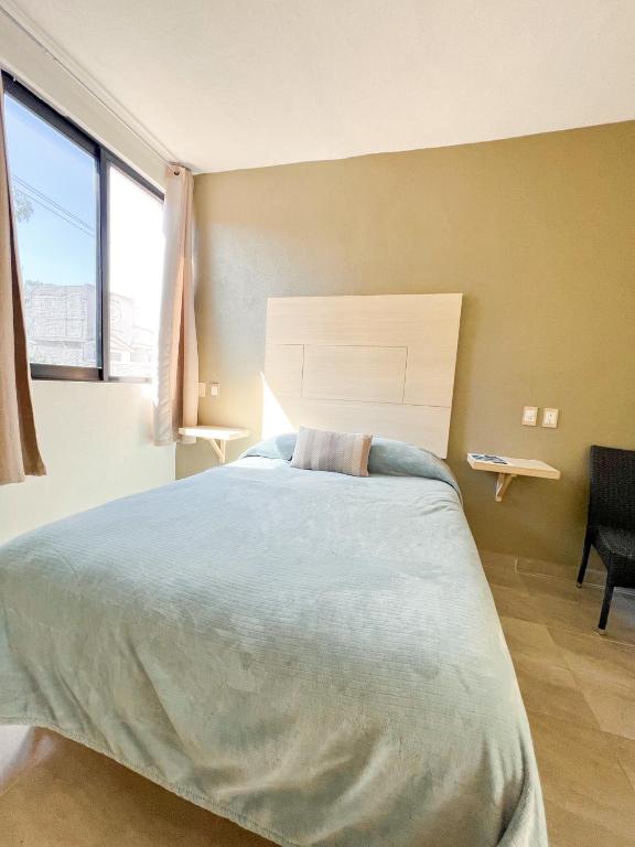 Postel nebo postele na pokoji v ubytování Hotel Hai Do