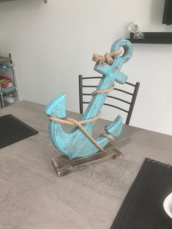 a statue of an anchor on a table at The Angels House in Fossacesia