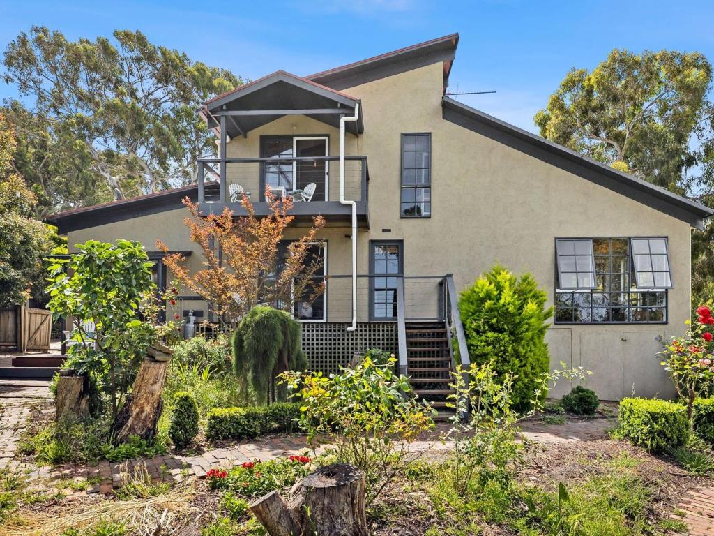 a house with a garden in front of it at Erskine Beach House in Lorne