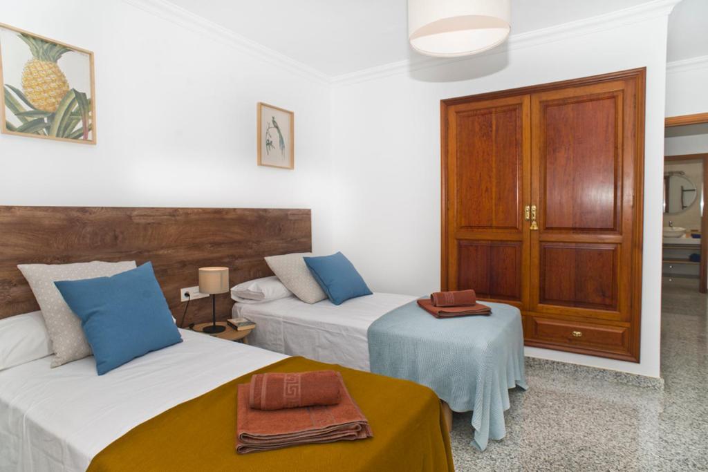 Postel nebo postele na pokoji v ubytování Villa Pilar