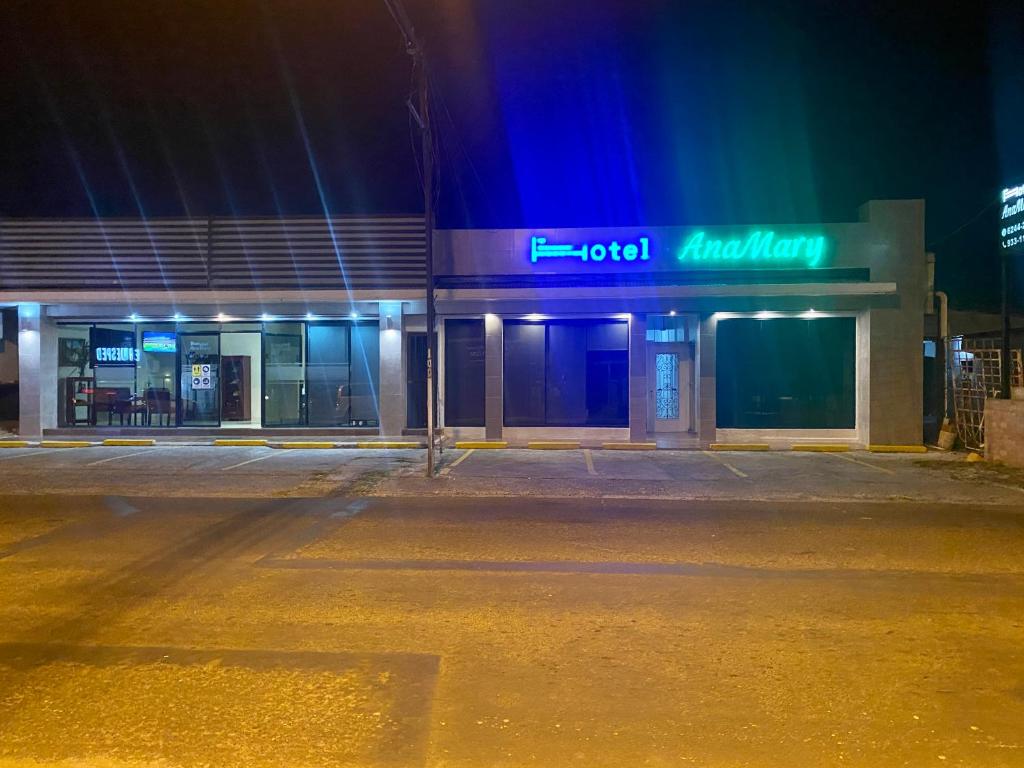 an empty street in front of a building at night at Hotel Ana Mary in Santiago