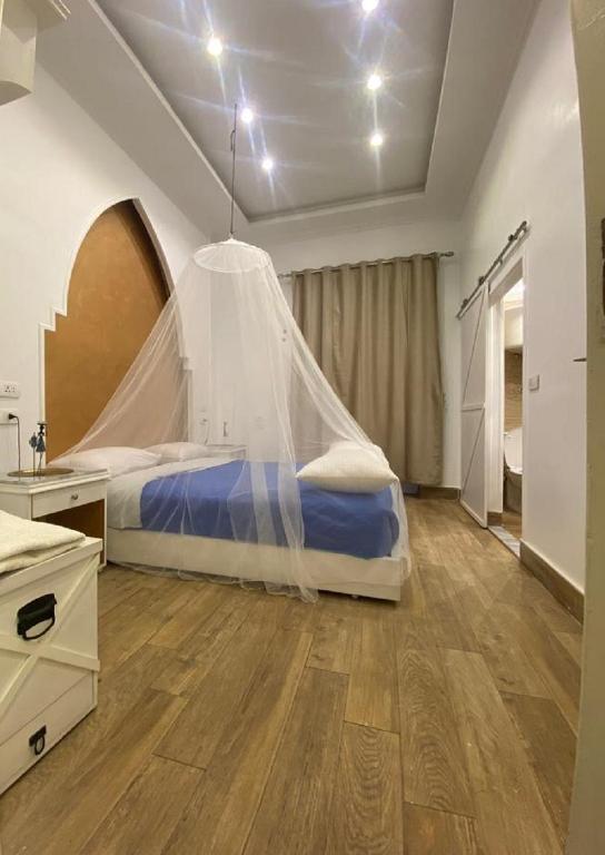 Postel nebo postele na pokoji v ubytování Paris Hotel Cairo