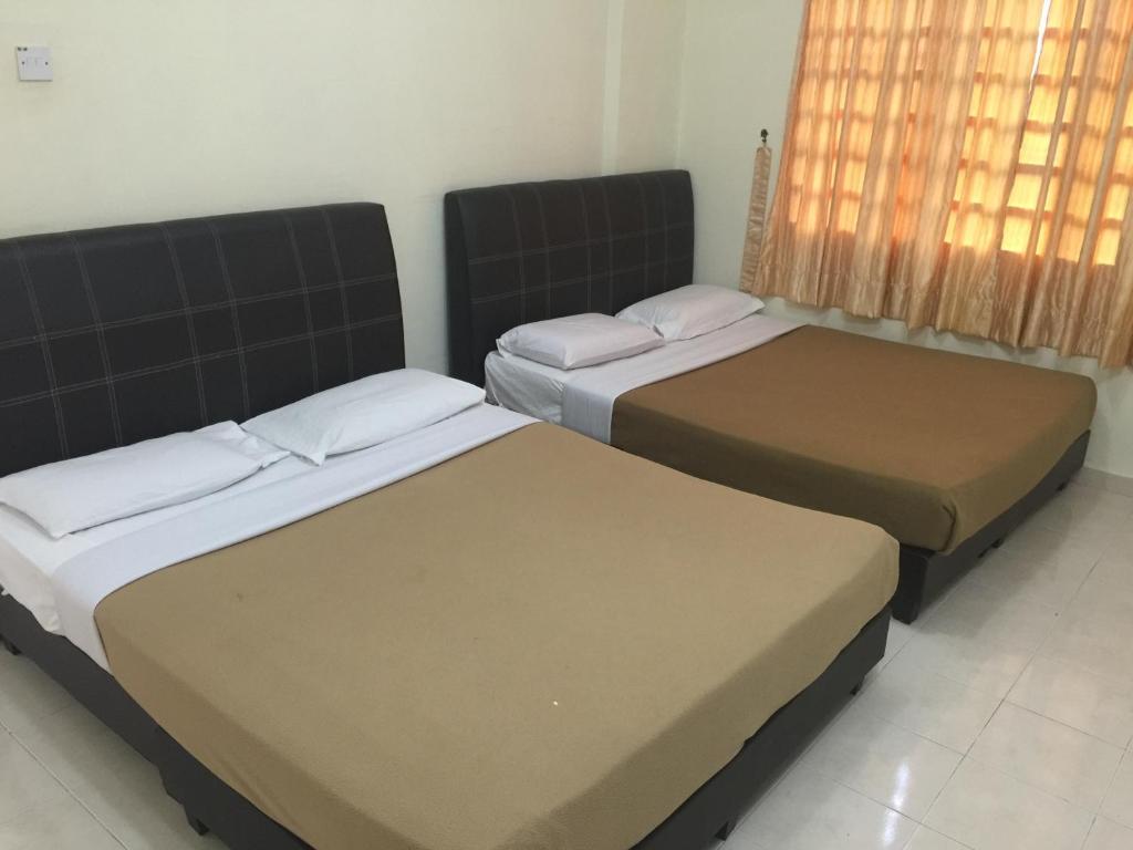 Giường trong phòng chung tại Cameron One Room Apartment @ Crown Imperial Court Brinchang