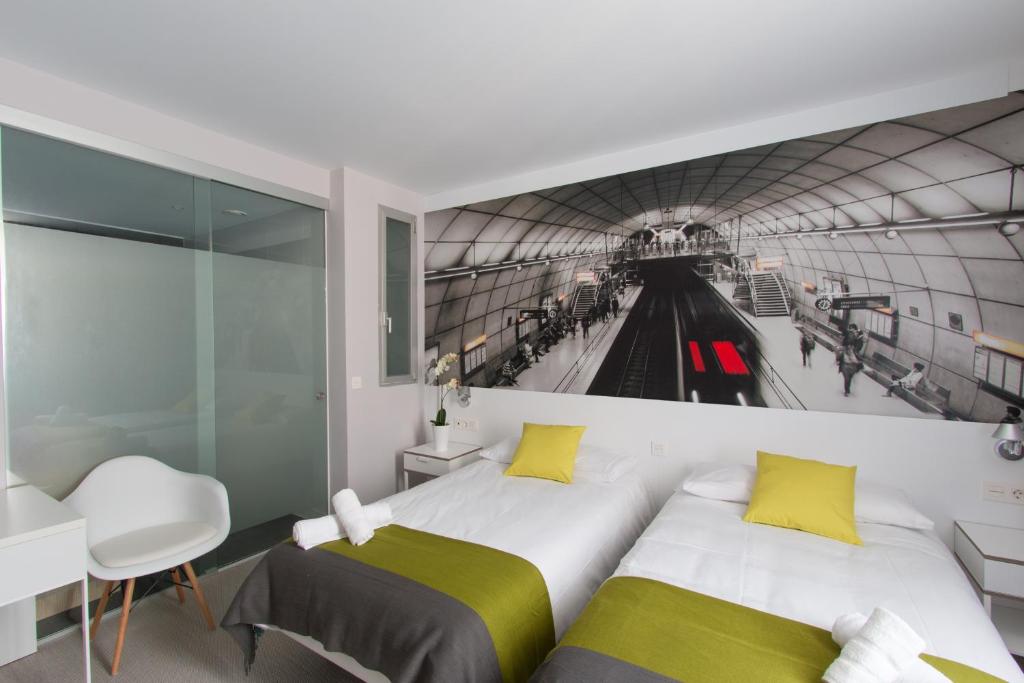 Кровать или кровати в номере Bilbao City Rooms