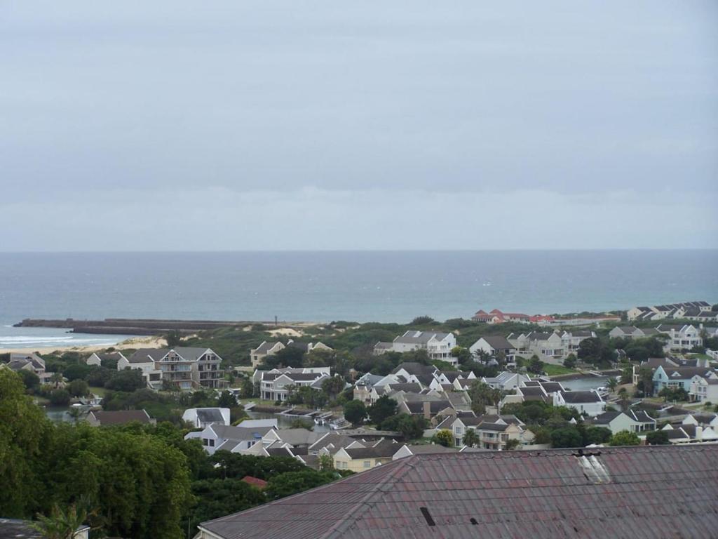 a view of a town with houses and the ocean at THE VIEW in Port Alfred