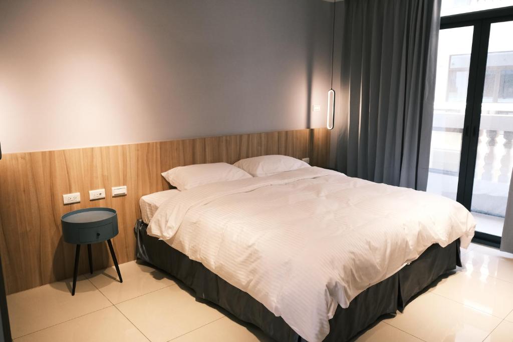 Postel nebo postele na pokoji v ubytování 飛鳥集行館