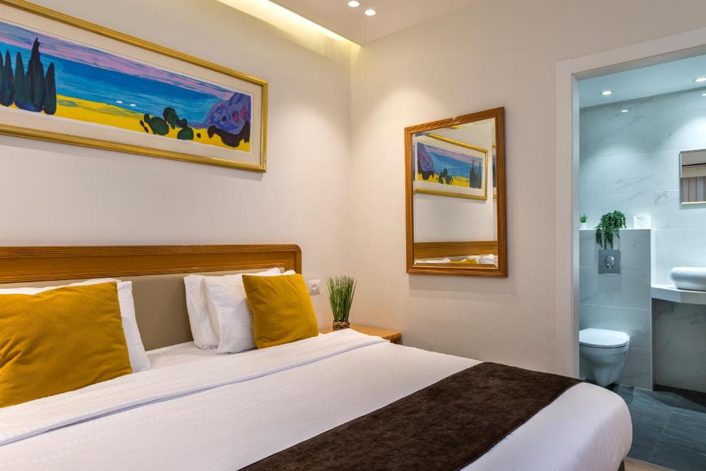Postel nebo postele na pokoji v ubytování Melio Hotel Eilat