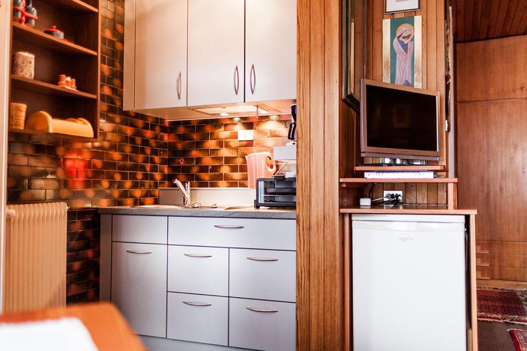 Kuchyň nebo kuchyňský kout v ubytování Appartements Claudia
