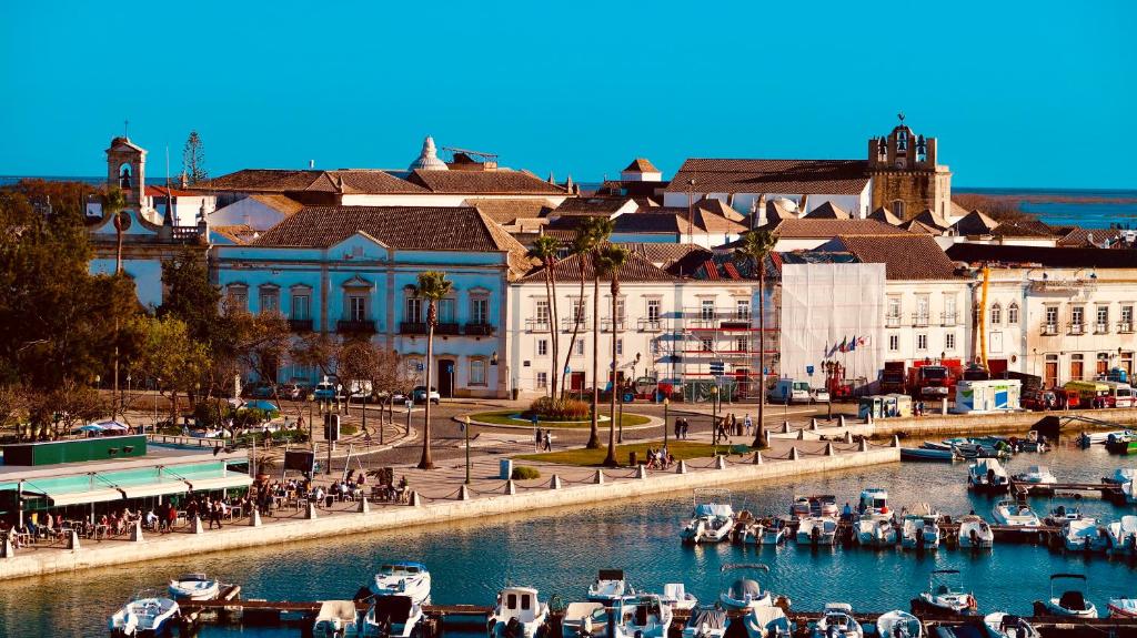 a group of boats in the water in a harbor at Casa Saudade luxury rooms in Faro