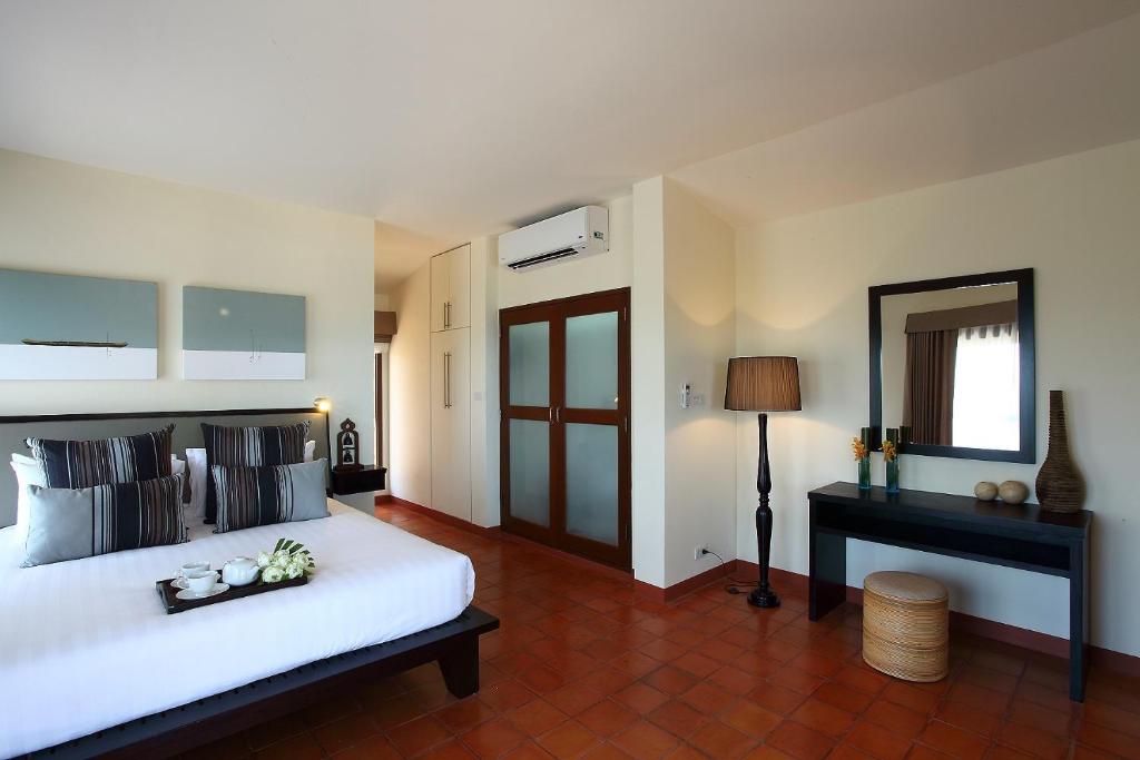 a bedroom with a large white bed and a mirror at Villa Alpha - Seaview Private Villa in Choeng Mon Beach