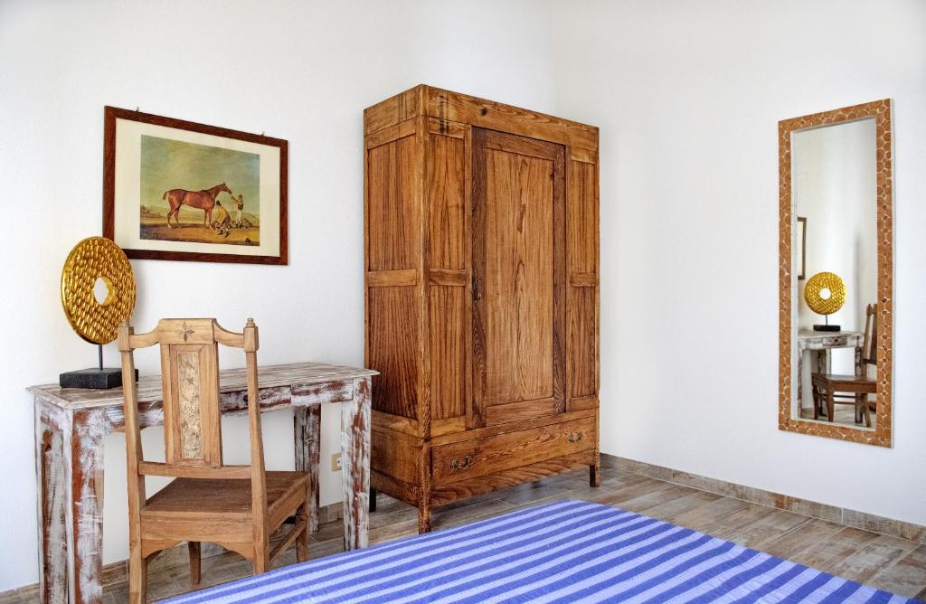 Łóżko lub łóżka w pokoju w obiekcie Appartamenti Podere San Sebastiano