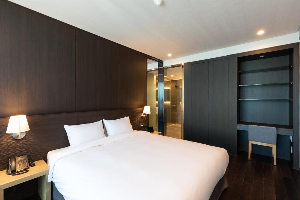 Postel nebo postele na pokoji v ubytování SL Hotel Gangneung