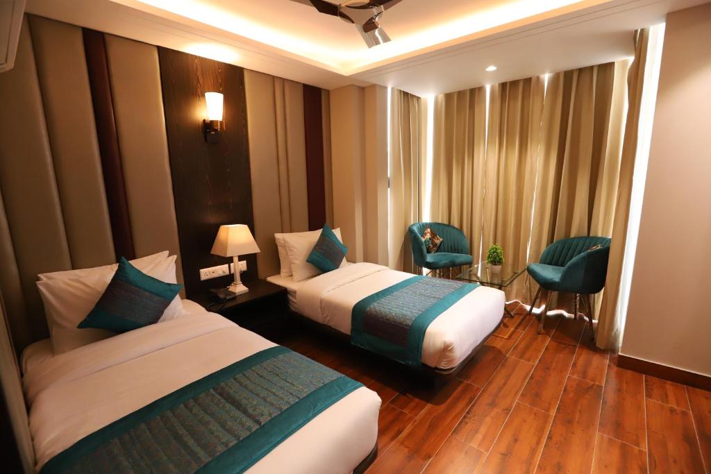 Postel nebo postele na pokoji v ubytování Hotel The Magic Tree - Paharganj New Delhi