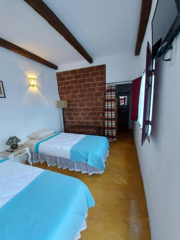 Säng eller sängar i ett rum på Casa do Páteo