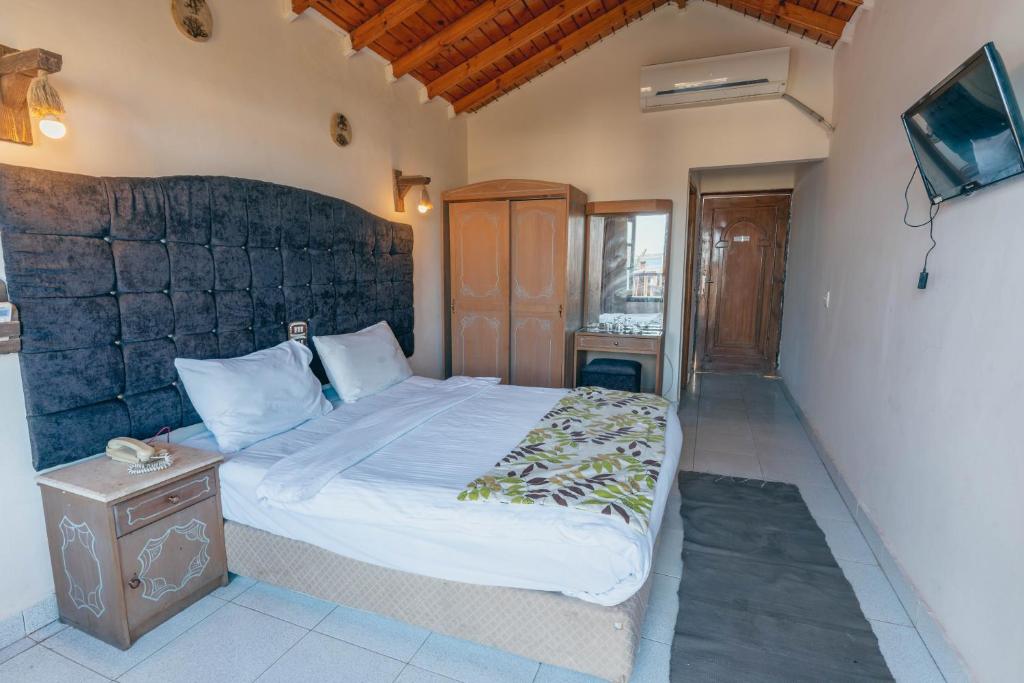 Postel nebo postele na pokoji v ubytování Ganet Sinai Resort