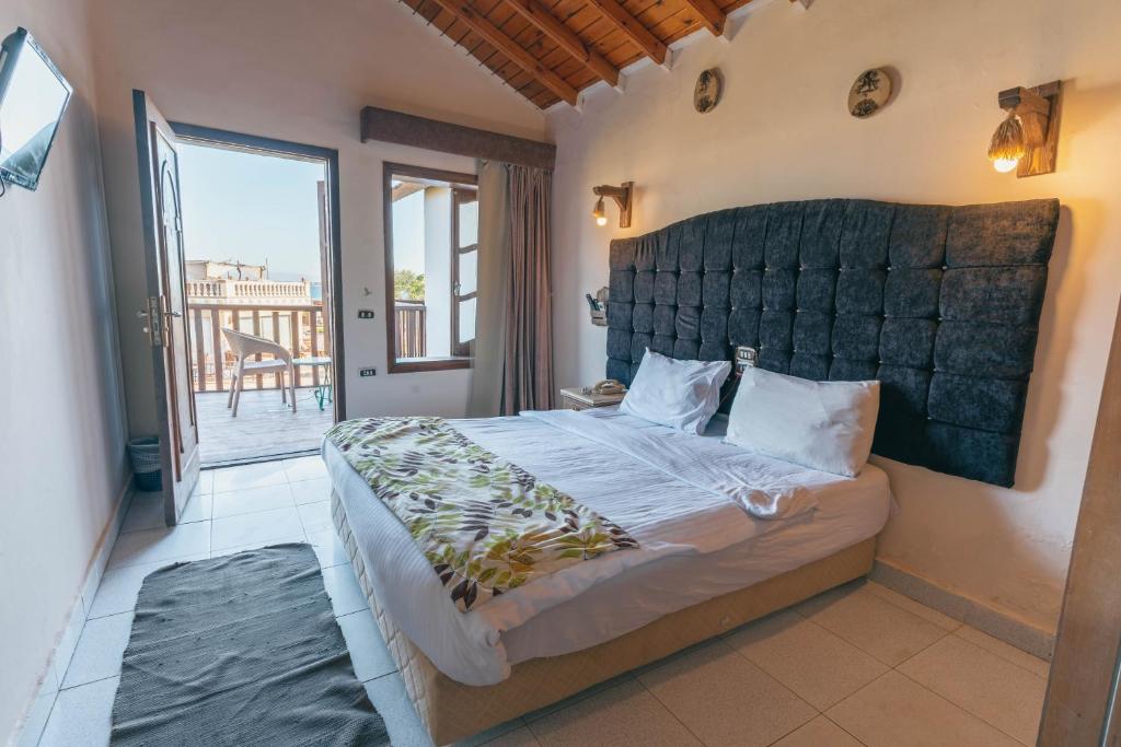 Postel nebo postele na pokoji v ubytování Ganet Sinai Resort