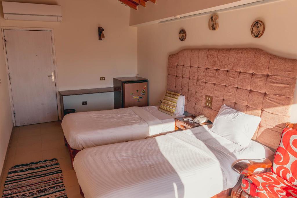 Postel nebo postele na pokoji v ubytování Ganet Sinai Resort