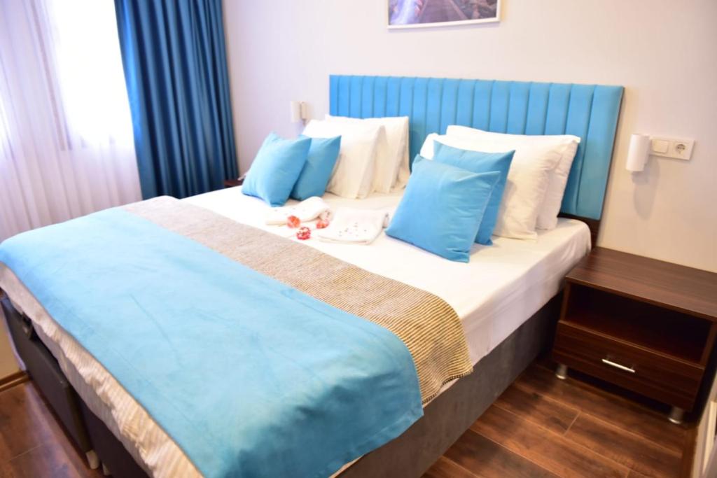 A bed or beds in a room at Nos Istanbul