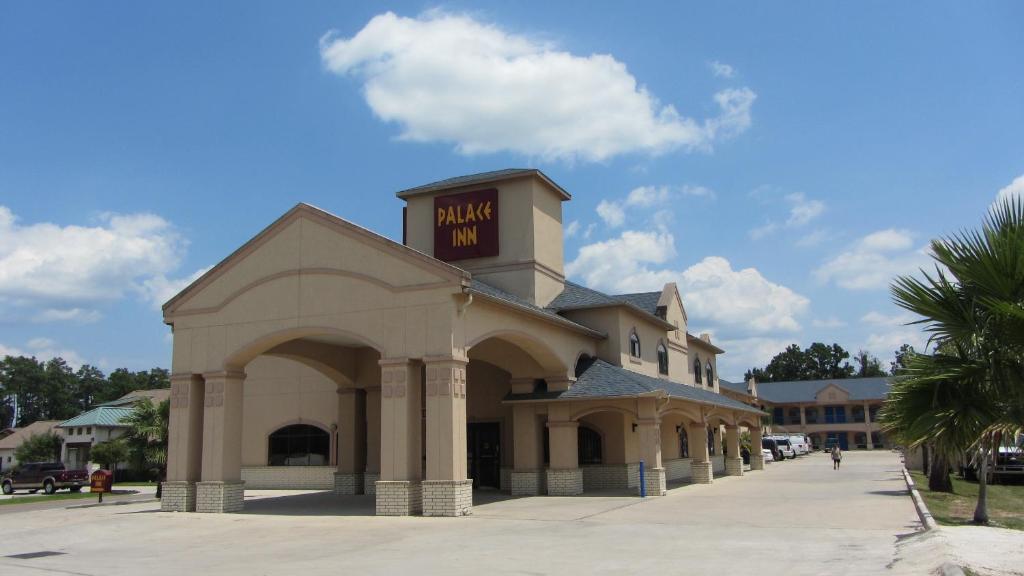a large building with a sign on top of it at Regency Inn Porter in Porter