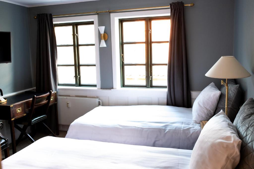Postel nebo postele na pokoji v ubytování Hotel Hamlet