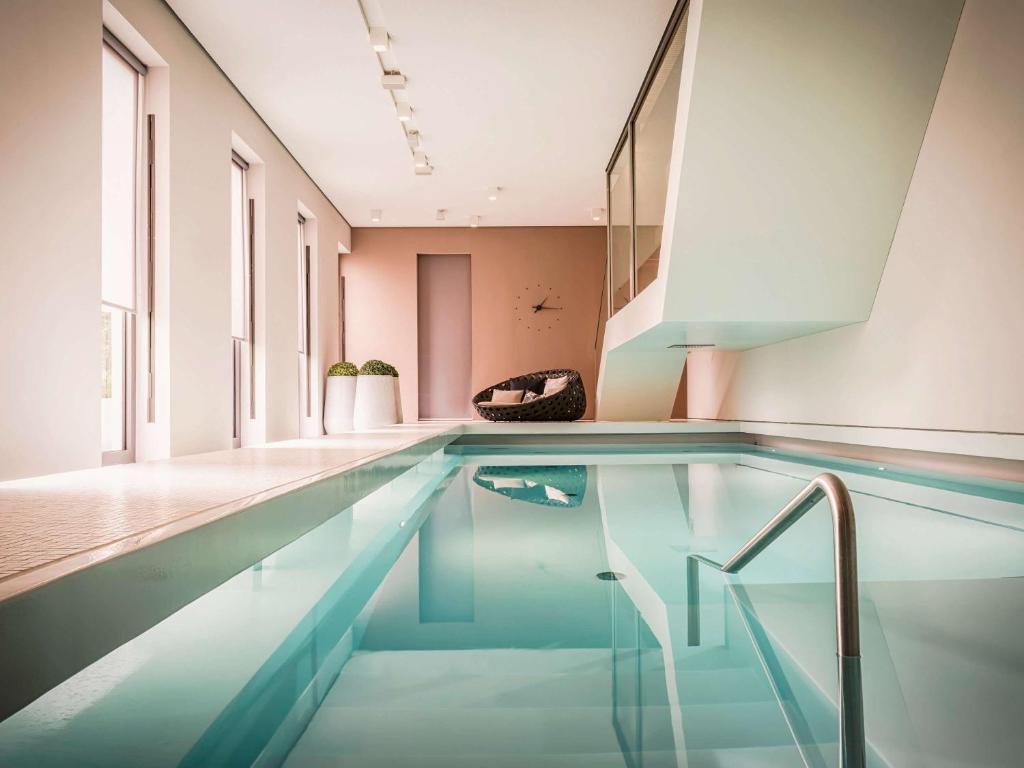 a swimming pool in a house at SO/ Berlin Das Stue in Berlin