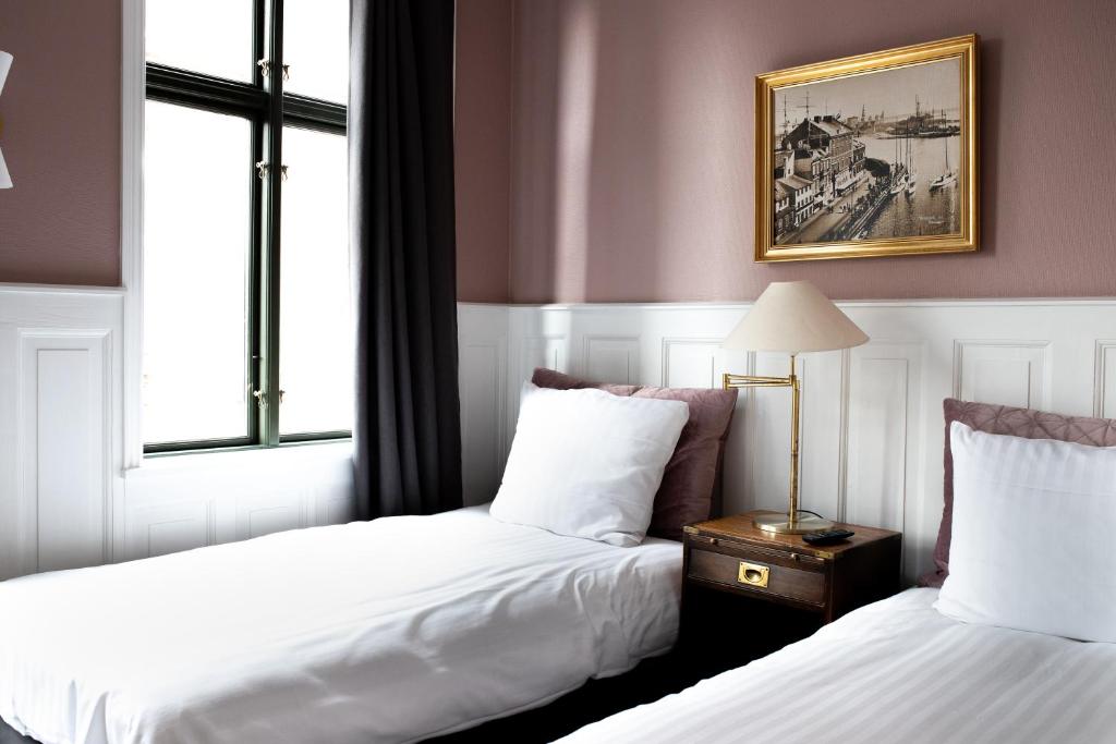 Postel nebo postele na pokoji v ubytování Hotel Hamlet