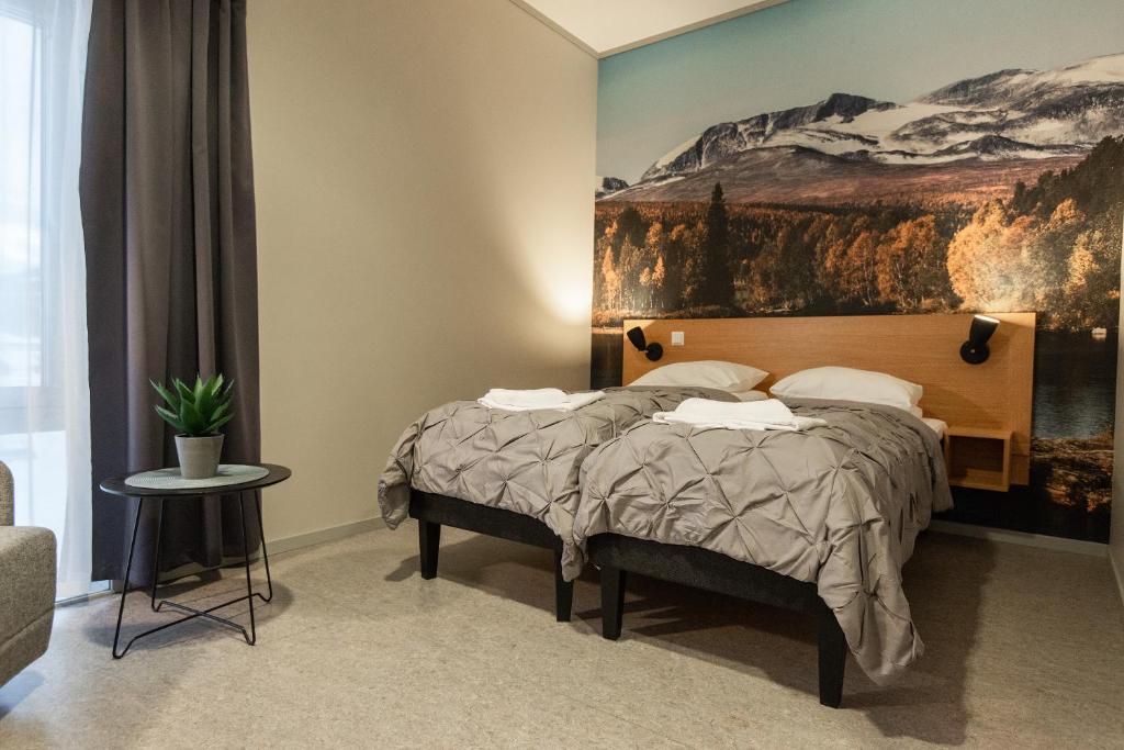 Postel nebo postele na pokoji v ubytování Fjellfolkets Hus