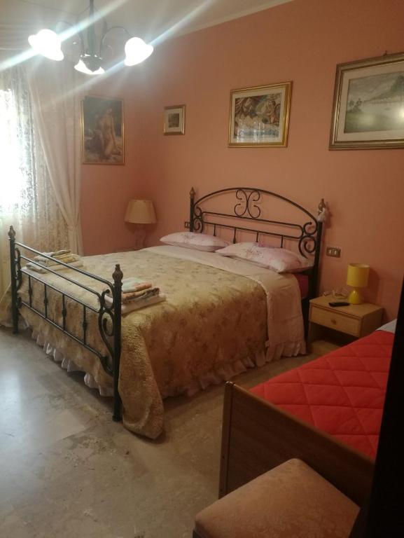 Postel nebo postele na pokoji v ubytování Le Magnolie B&B