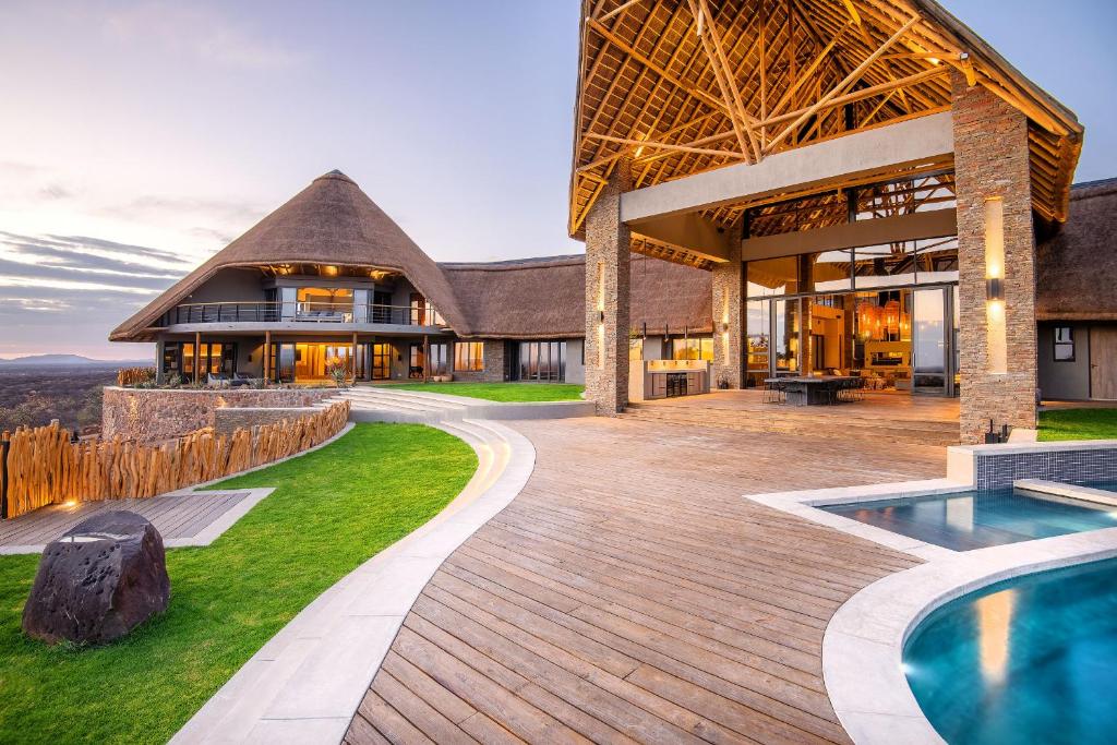 an exterior view of a house with a swimming pool at TimBila Private Villa in Omaruru