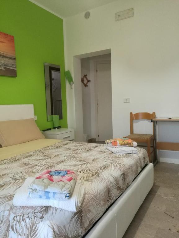 Postel nebo postele na pokoji v ubytování Le Magnolie B&B