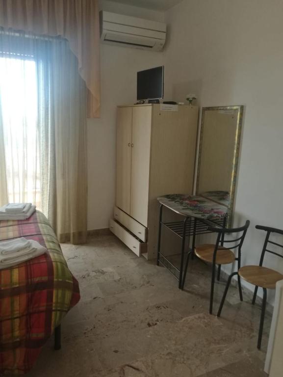TV a/nebo společenská místnost v ubytování Le Magnolie B&B