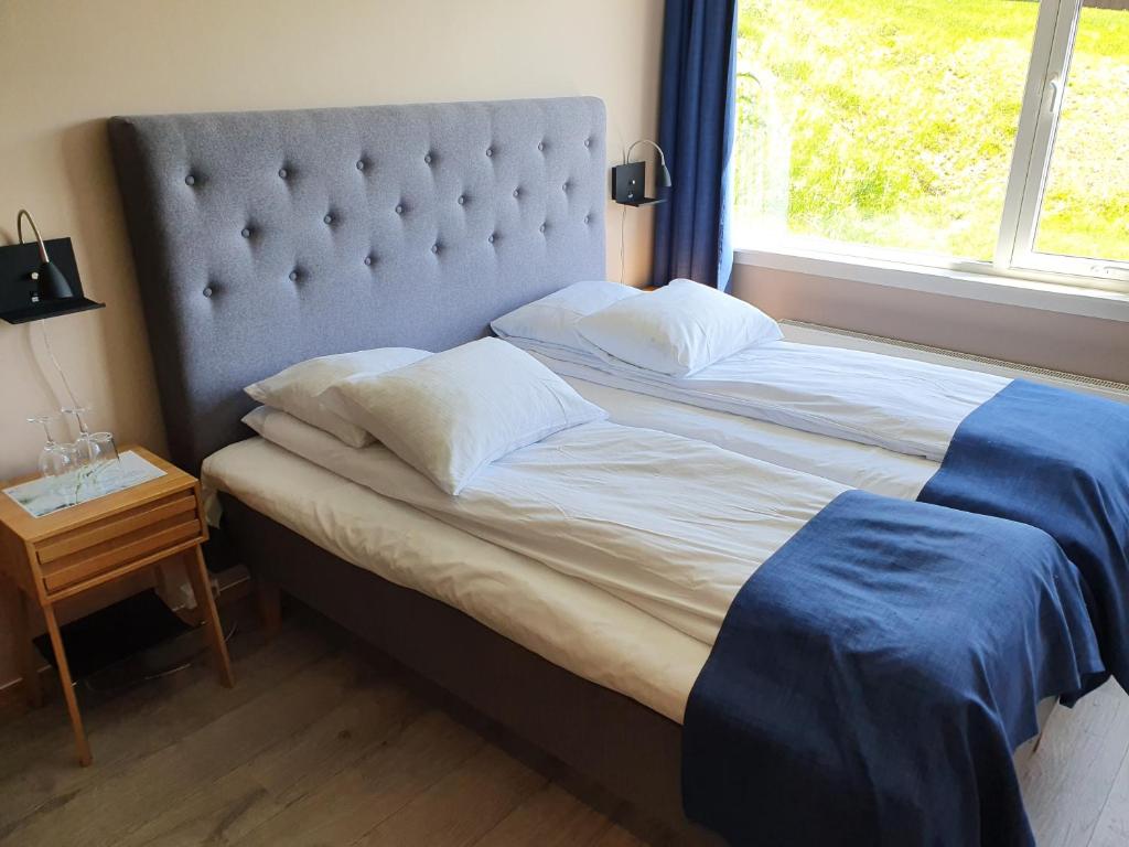 Postel nebo postele na pokoji v ubytování Røros Hotell - Bad & Velvære