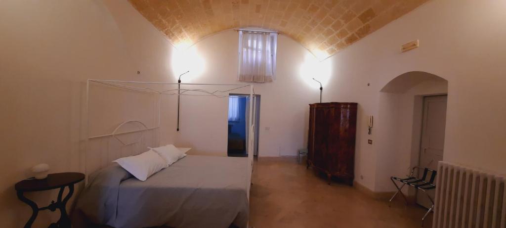 Postel nebo postele na pokoji v ubytování Palazzo Bernardini B & B