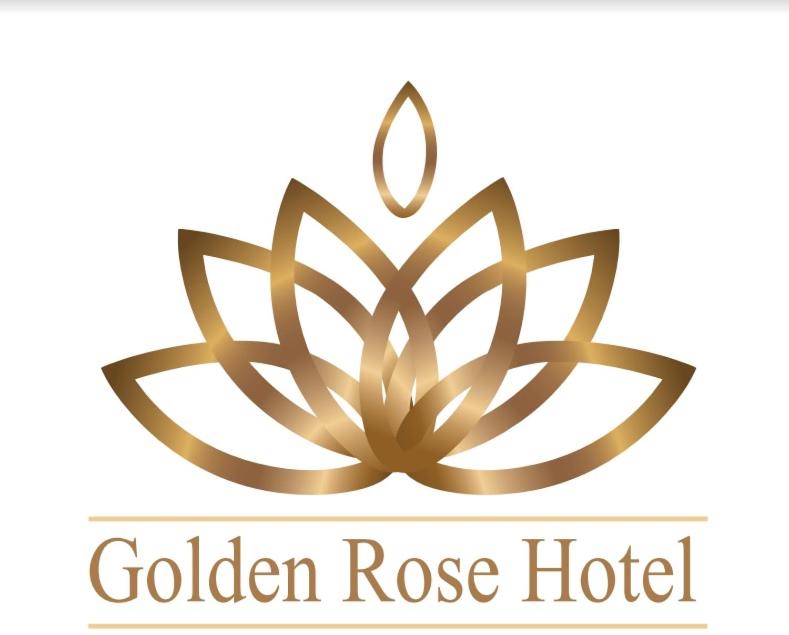 a gold logo for a golden rose hotel at Golden Rose Hotel in Nablus