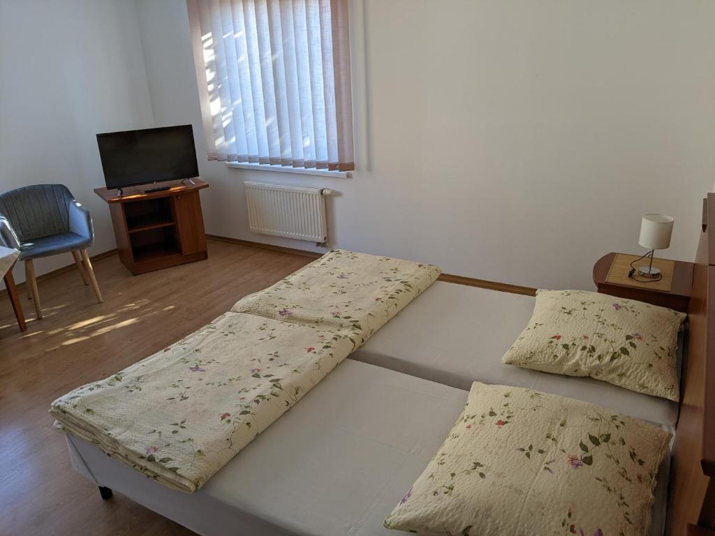 Posteľ alebo postele v izbe v ubytovaní Pokoje Gościnne - Leśna 8