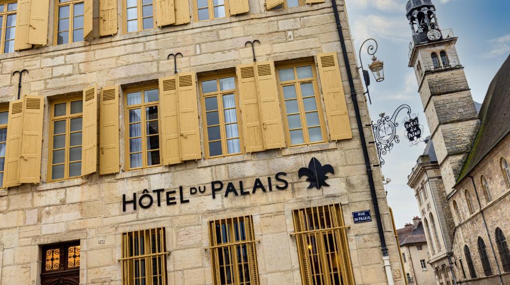 a hotel palais on the side of a building at Hotel du Palais Dijon in Dijon