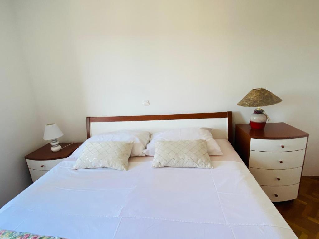 Postel nebo postele na pokoji v ubytování Apartment Tina
