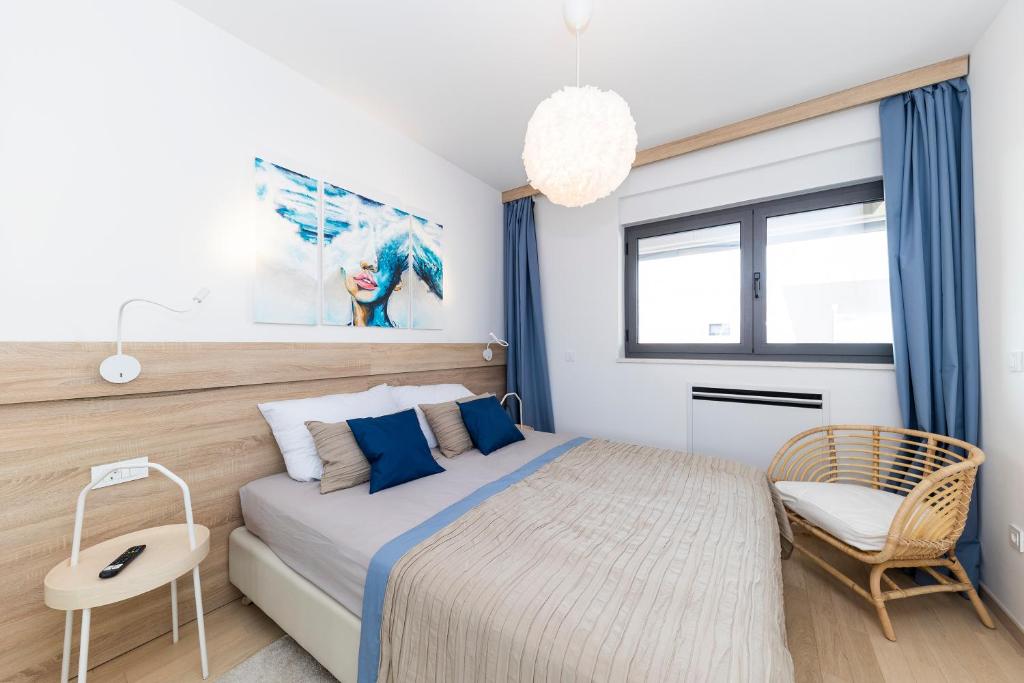 Posteľ alebo postele v izbe v ubytovaní Apartman 4U
