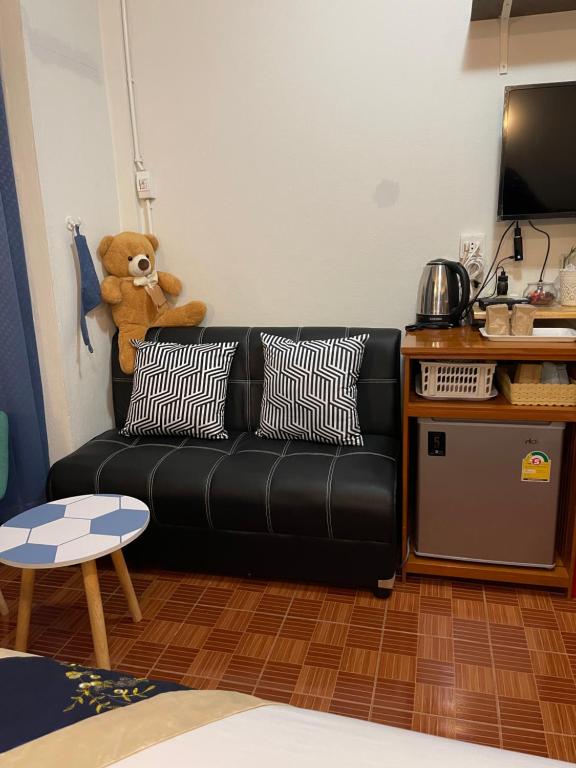 A sofa corner beside the room’s minibar and tea station.