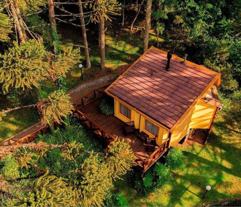 an aerial view of a house with a roof at Villa Flor Ecoresort in Nova Petrópolis
