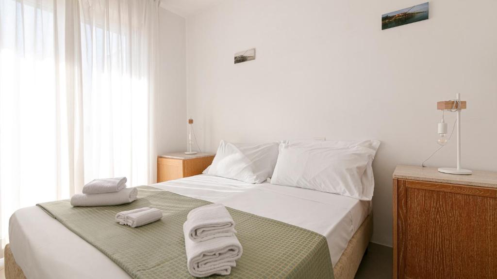 Posteľ alebo postele v izbe v ubytovaní Residenza Excelsior
