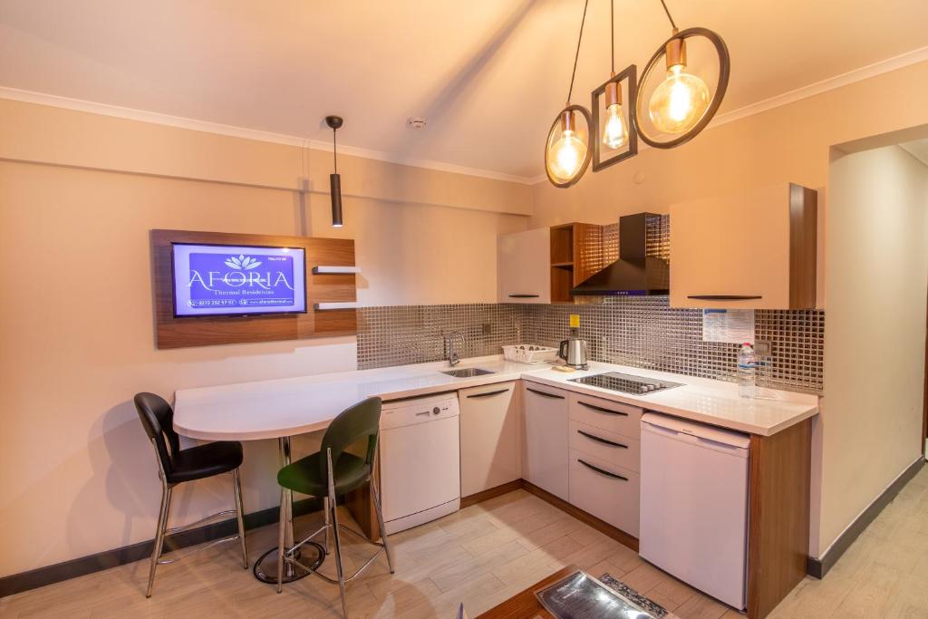 Kuchyň nebo kuchyňský kout v ubytování Aforia Thermal Residences