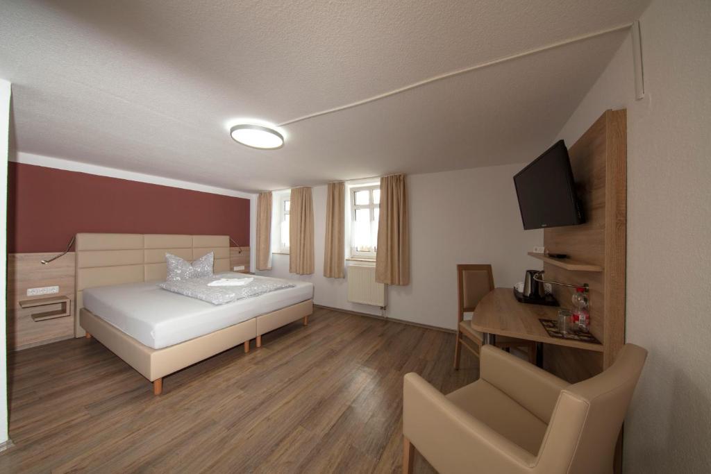 Postel nebo postele na pokoji v ubytování Hotel Maximilian