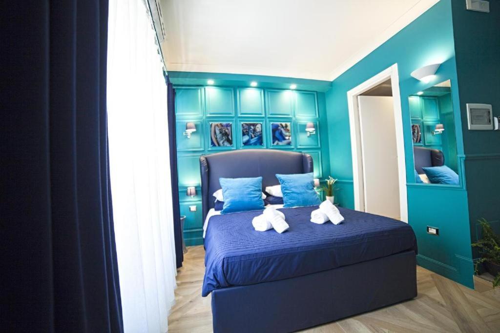 A bed or beds in a room at Vatican Luxury Home