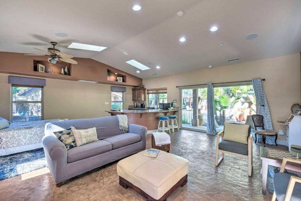 a living room with a couch and a table at Bright Poway Studio with Shared Outdoor Oasis! in Poway