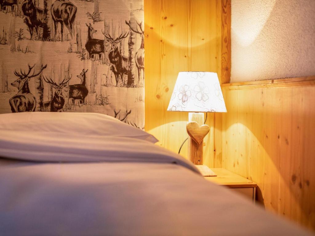 Posteľ alebo postele v izbe v ubytovaní Chalet Osmar Appartamento 1